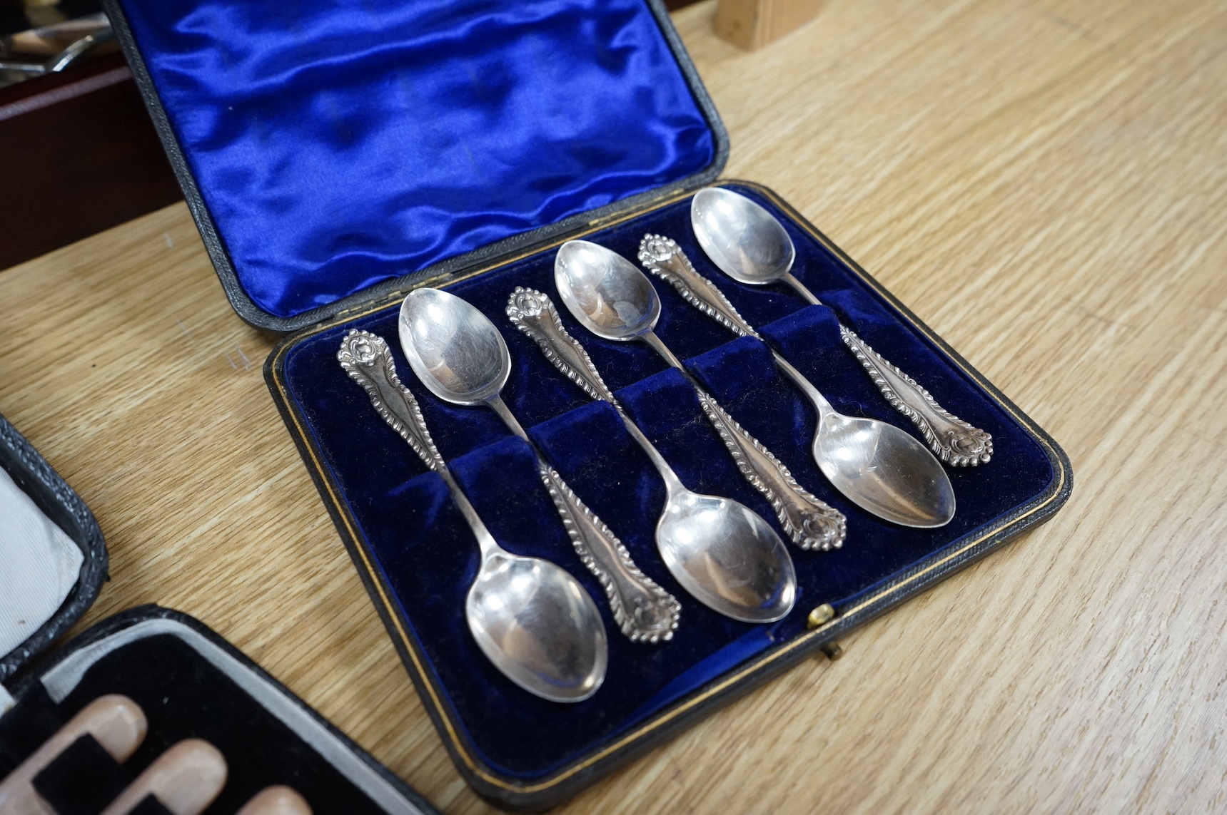 A group of assorted cased plated flatware and a cased set of six Edwardian silver teaspoons by Charles Wilkes, Birmingham, 1904. Condition - fair